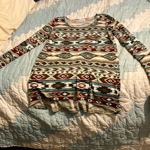 A long sleeve tee-shirt. Size XXS. Western patterns.